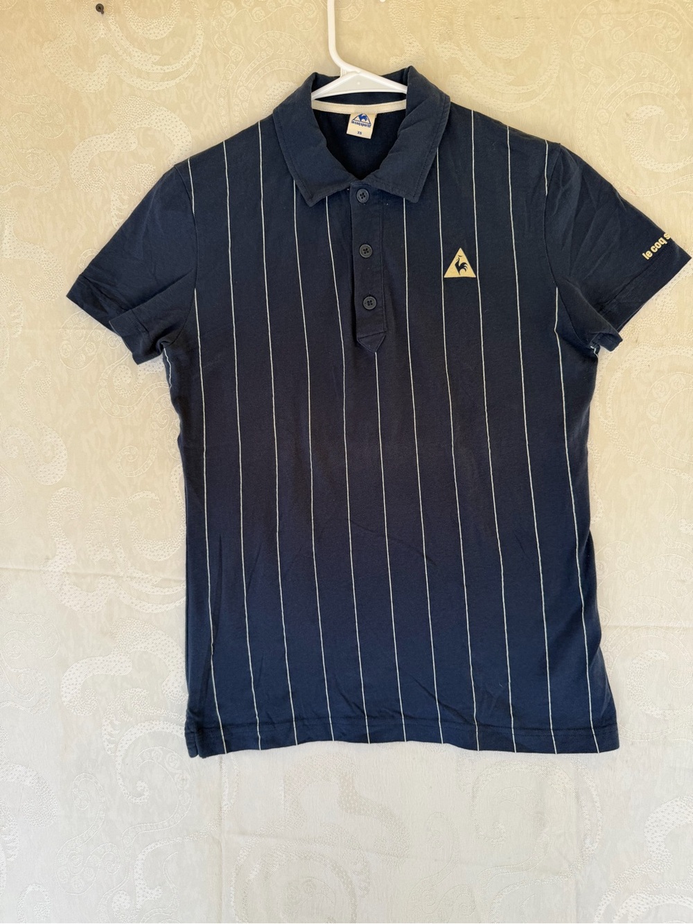 Le Coq Sportif Navy Polo with White Pinstripes and Gold Logo